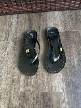 Tory Burch Black jelly Flip Flop Sandals with bow and Gold Logo Accent
